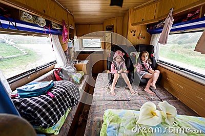 Children strapped in children safetyÂ seats when driving in motorhome Stock Photo